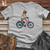 Penguin Riding Bicycle Softstyle Tee