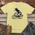 Viking Goods Cow Riding a Bike Heavy Cotton Comfort Colors Tee Banana / L