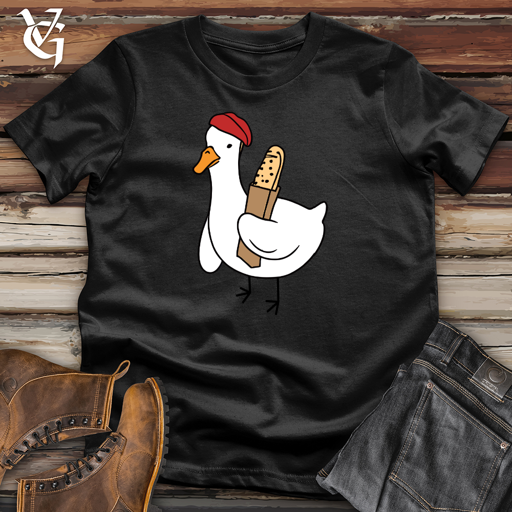 A Red Hat Wearing Duck Holding a Baguette Softstyle Tee