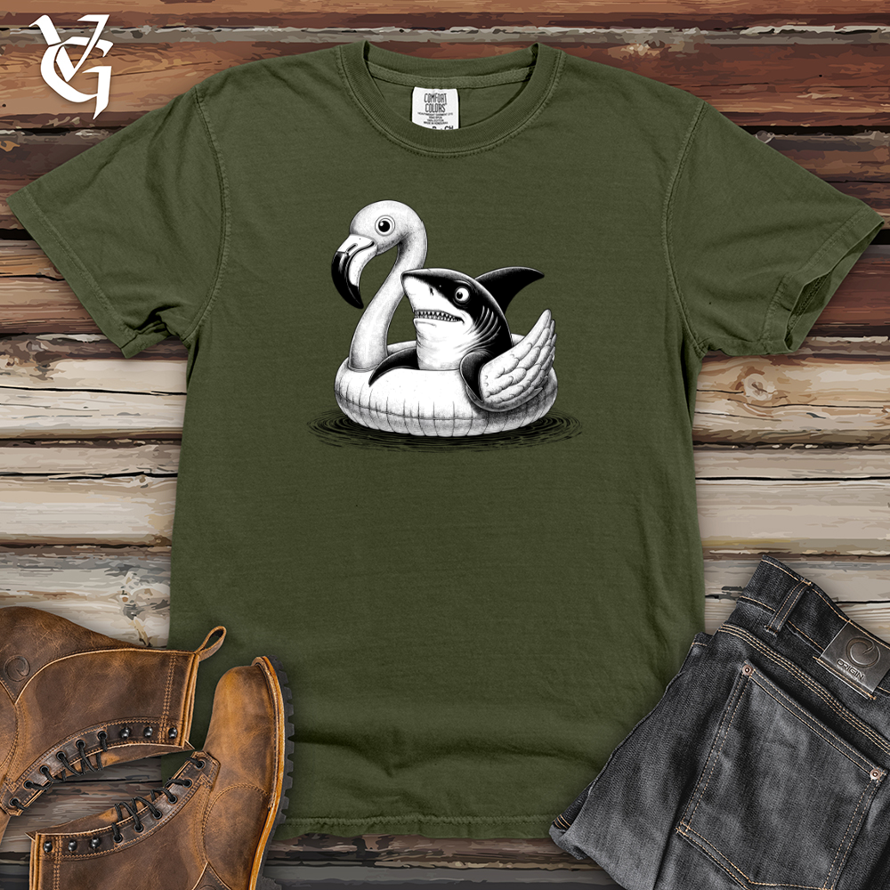 A Shark laying on top of a Flamingo Heavy Cotton Comfort Colors Tee