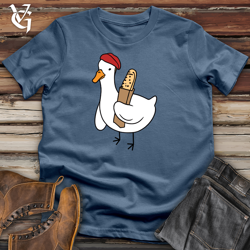 A Red Hat Wearing Duck Holding a Baguette Cotton Tee