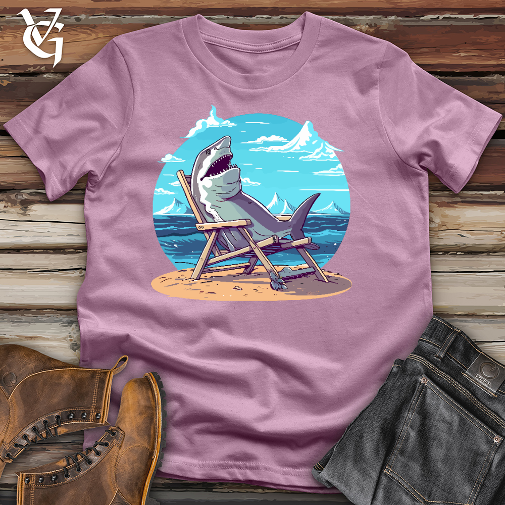 Viking Goods Shark Sitting in a Beach Chair in the Sand Cotton Tee Orchid / L